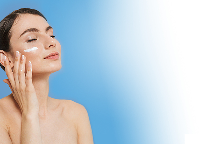 Woman applying skin cream